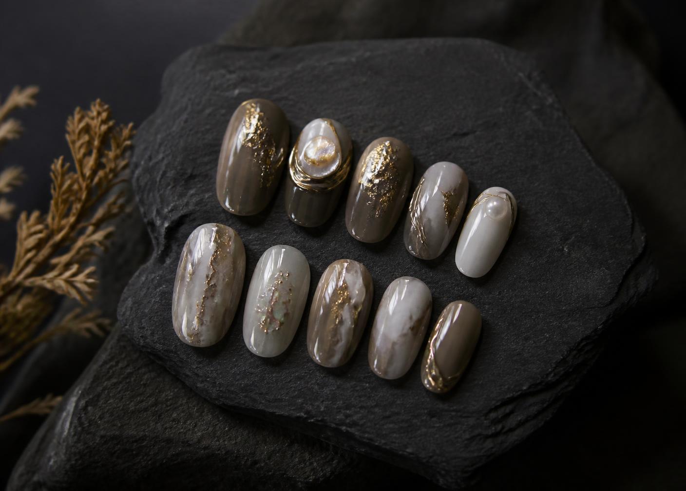 Famous Claws luxury handmade nail set styled on dark stone